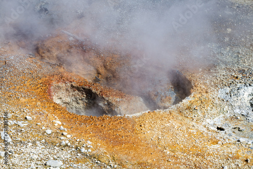 Fotografie Steaming Geothermal Fumarole with Colorful Mineral Deposits