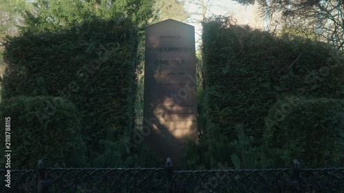 The grave of Hans Christian Andersen, the world-renowned Danish writer and poet from the 19th century. Gimbal shot