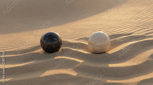 A symbolic representation of an amicable divorce featuring two distinct marble spheres resting separately on a peaceful desert landscape with soft sunset light
