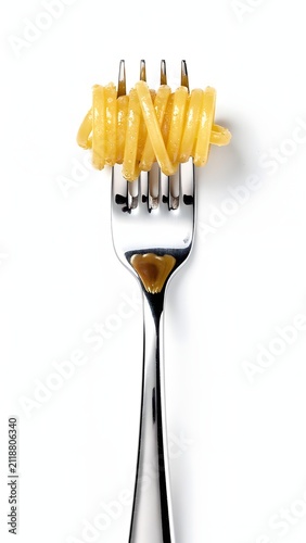 Single fork with twirled spaghetti pasta isolated on white background, world pasta day concept