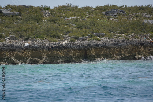 Rocky shore with light blue water