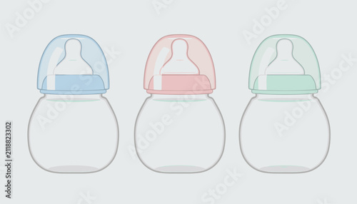 Three baby bottles with different colored nipples and lids standing in a row as a symbol of infant feeding and nursery care products.