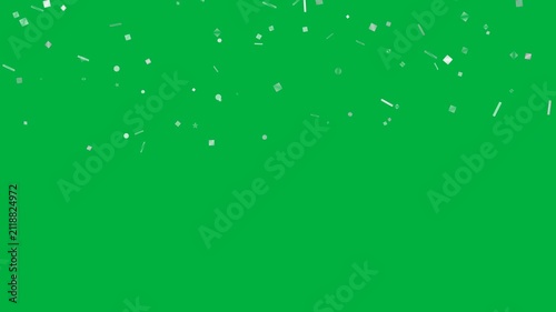 Silver confetti falling slow down on chroma key green background, celebration effect, party and