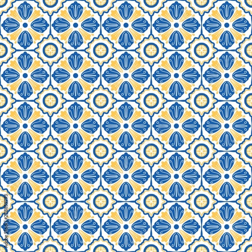 Traditional Mediterranean-inspired seamless floral tile pattern featuring blue and golden yellow ornamental motifs. A repeating geometric design ideal for textile printing, wallpaper, ceramic decorati