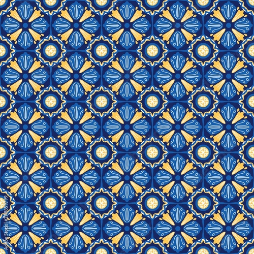 Traditional Mediterranean-inspired seamless floral tile pattern featuring blue and golden yellow ornamental motifs. A repeating geometric design ideal for textile printing, wallpaper, ceramic decorati