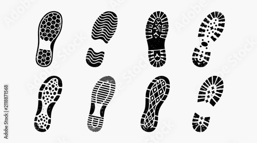 Collection of diverse shoe sole footprints isolated on white background.