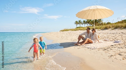 Family Enjoying a Sunny Summer Bank Holiday Beach Day
