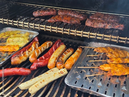 shish kebab, sausages and steak on the grill