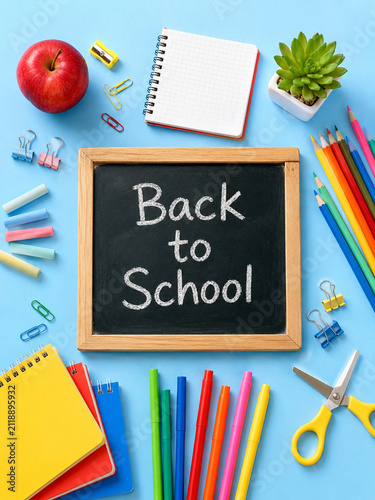 Back to School Flat Lay with Colorful School Supplies and Chalkboard