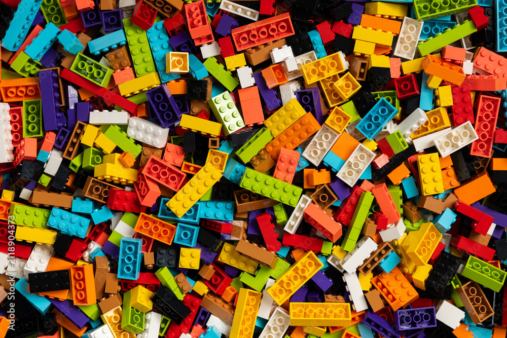 Fototapeta premium Colorful mix of plastic Lego building blocks and bricks background