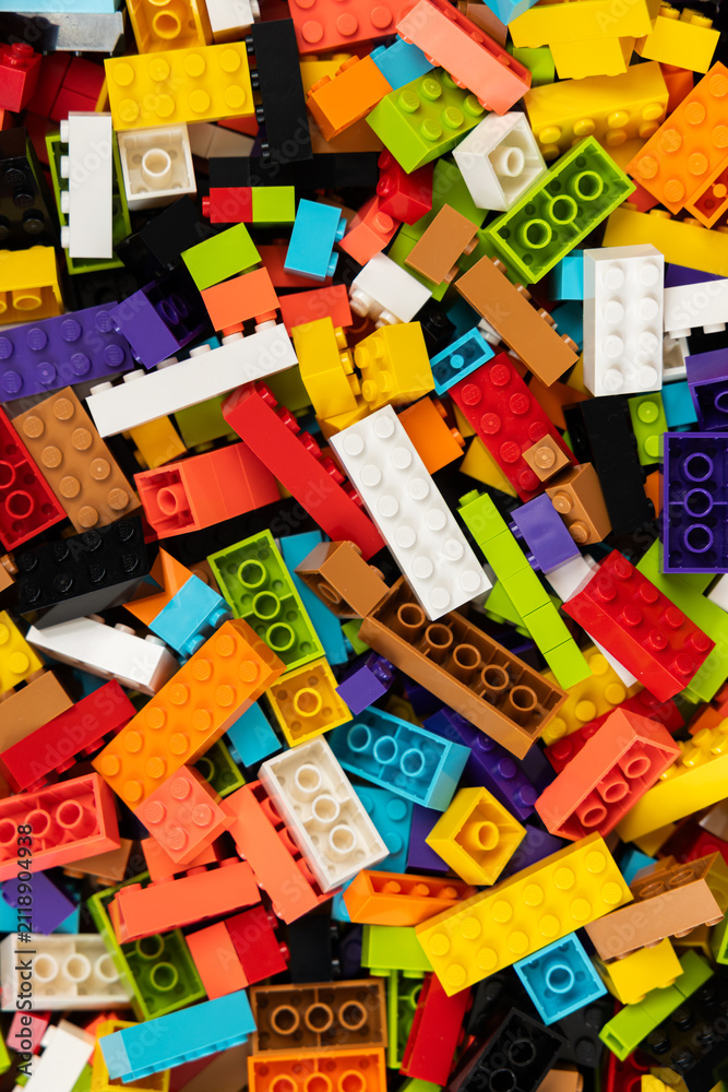 Fototapeta premium Colorful mix of plastic Lego building blocks and bricks background