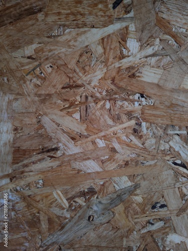 Smooth pressed wood particle board surface with natural timber shades, abstract construction material background