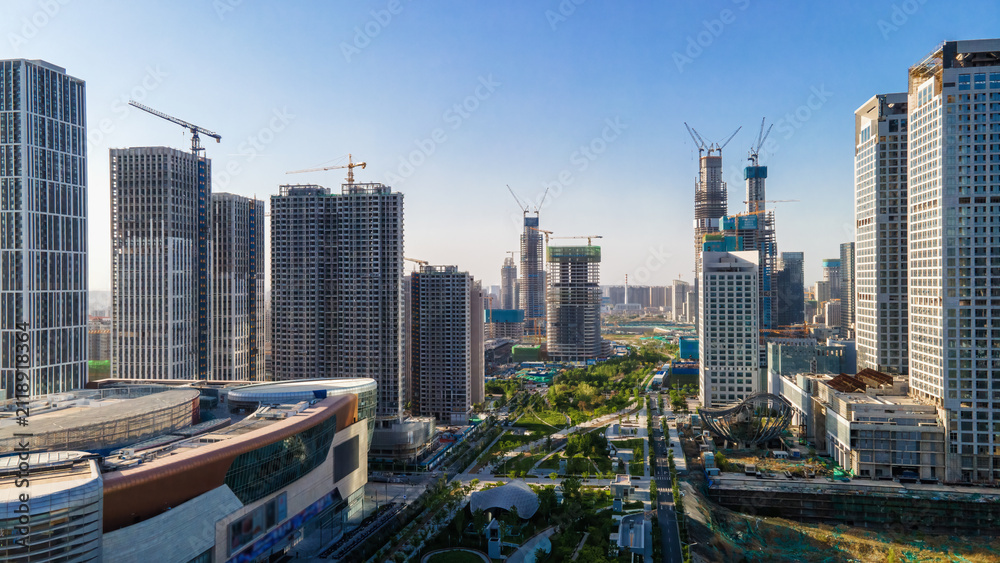 Fototapeta premium Modern Urban Skyline With Under Construction High Rise Buildings