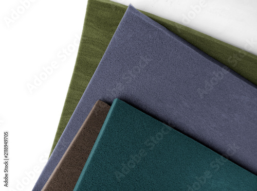 four sheets of thin, colorful sponge foam material with a white background and copy space.