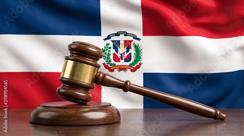 A gavel and sound block in front of the waving flag of the Dominican Republic, symbolizing law and justice in the Caribbean nation.