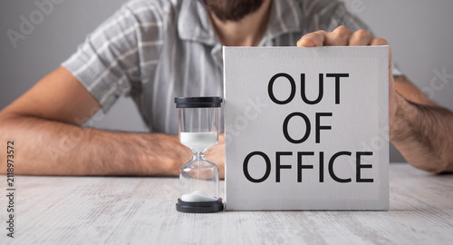 Man showing Out Of Office message.
