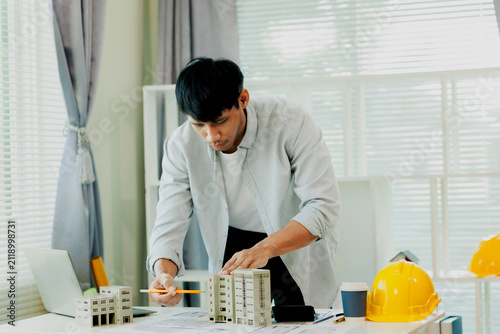 Confident mathematical engineer verifying building safety load tolerances using advanced business logic desktop.
