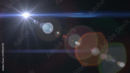 Bright anamorphic lens flare light streak overlay effect with colorful bokeh reflections moving across a dark black background for video production.