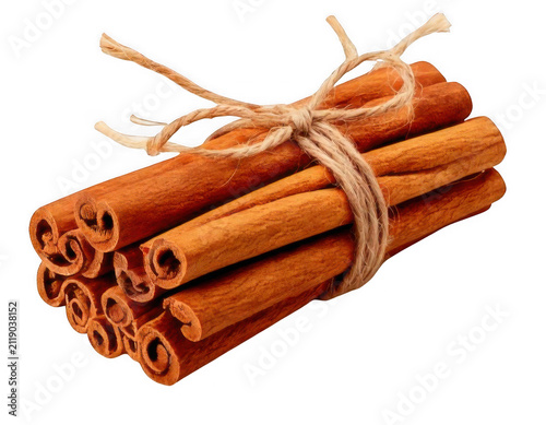 A bundle of organic cinnamon sticks tied together with a simple rustic twine string for cooking and baking isolated on transparent background