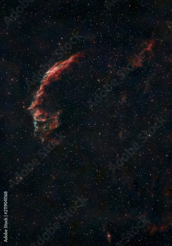 Eastern Veil Nebula glowing amid a dense star field in deep space.