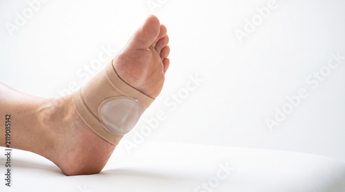 Arch support sleeve with gel pad on foot close up