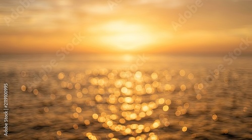 Golden Sunset Over Sparkling Ocean Water with Bokeh Effect