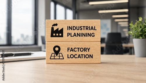 Wooden blocks illustrating industrial planning and factory location concepts in modern office setting