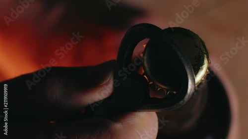 Macro Close-Up of Hand Opening a Beer Bottle