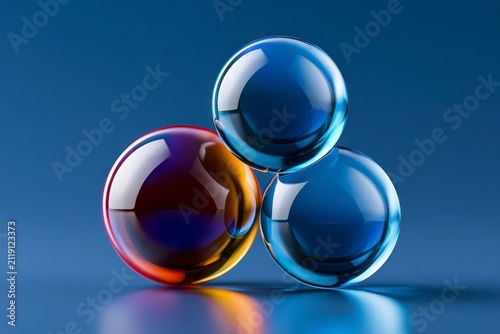 Abstract glass spheres floating on a blue background in a minimalist 3d rendering for technology branding and web design