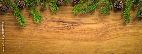 Christmas Pine Branches Framing Rustic Wooden Background