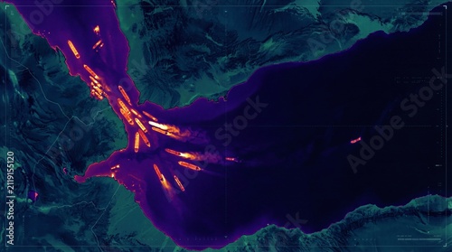 Aerial view of a large body of water surrounded by mountains.