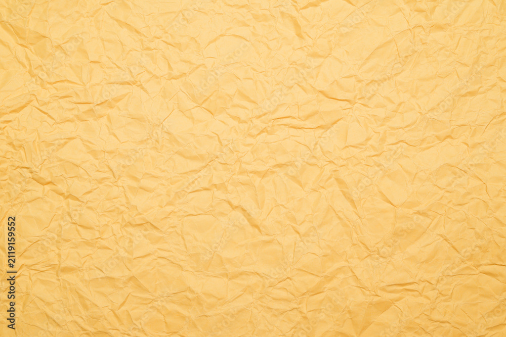 Fototapeta premium crumpled orange paper as texture background