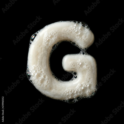 Solid soap with bubbles and foam letter G - large creative font isolated on black background. Perfect alphabet for creative illustrations related to beauty, hygiene, purity...