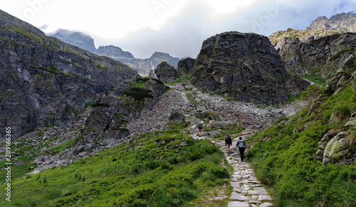 Hikers Ascending Rocky Tatra Pass