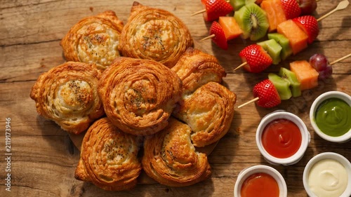 Gourmet pastry fruit platter with fresh berries and dipping sauces perfect for breakfast or brunch a rustic delicious food photography setup