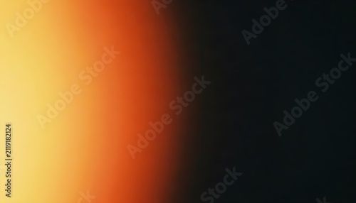 Abstract gradient of warm orange and yellow fading into deep black