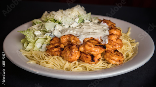 view of a social lunch club set. A small bowl of Caesar salad is positioned beside a main plate of grilled prawns and zesty pasta. The textures of the pasta and seafood are highly detailed. 