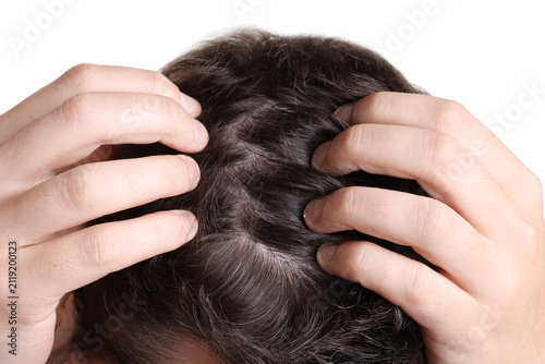 Foto Man examining his head on white background, closeup