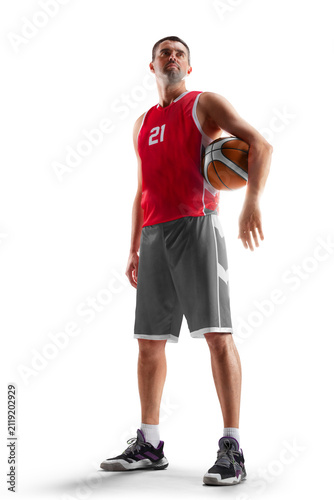 Basketball player. Full length studio shot of an athletic basketball player in a confident stance holding a ball. Isolated on white background