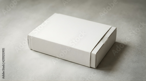 Closed White Cardboard Box Packaging For Shipping and Delivery On A Light Gray Surface With Minimalist Studio Lighting