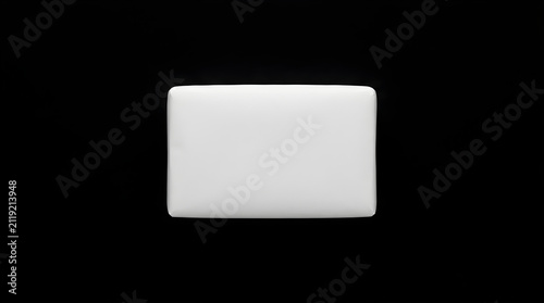 Closed White Laptop Computer Sitting on a Plain Black Background with No Distractions or Clutter