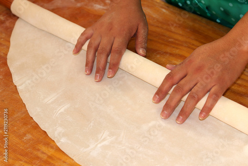 woman rolling dough