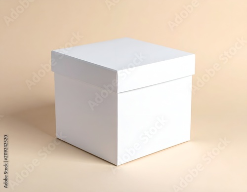 Blank white square gift box with lid isolated on a neutral studio background