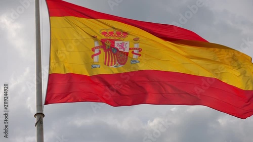 Spanish national flag waving with its coat of arms