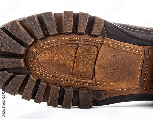 Close up view of a durable leather boot outsole with a rugged tread pattern