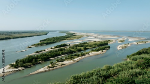 Serene River Landscape With Green Islands And Curving Waterways
