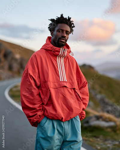 Man in Red Jacket on Road