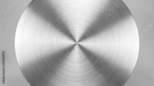 Circular brushed metal texture with radial pattern and bright reflections