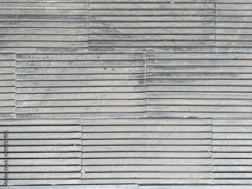Canvas Print Grey stone tile texture with horizontal grooved lines, modern architectural background