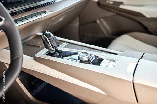 neutral car gear shift in stationary interior close-up view plastic and metal materials clean and natural light editorial and educational visual resource for automotive.